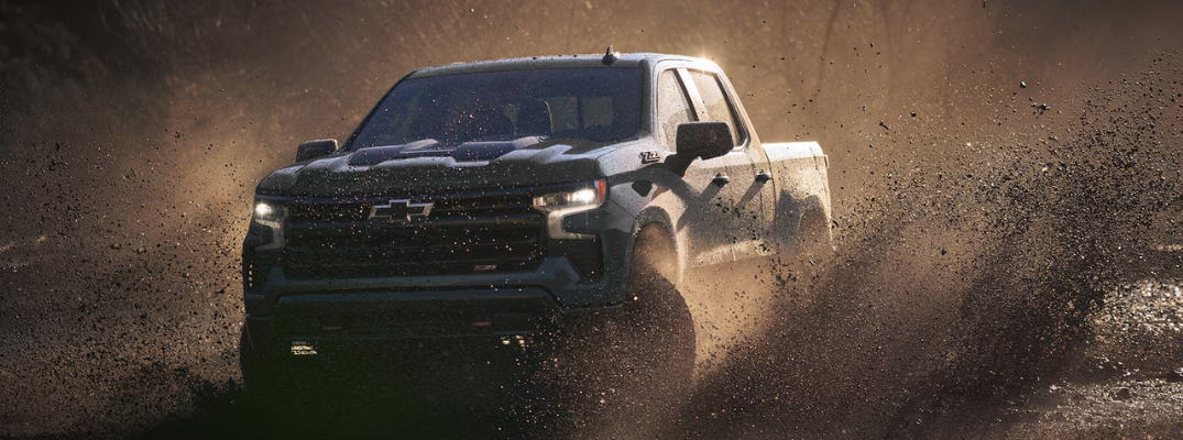 A Chevrolet Silverado driving off-road