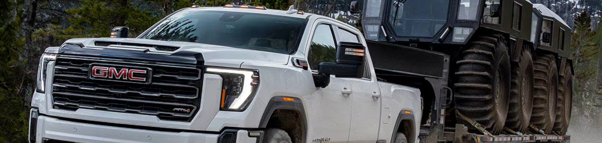2026 GMC Sierra HD towing a large trailer